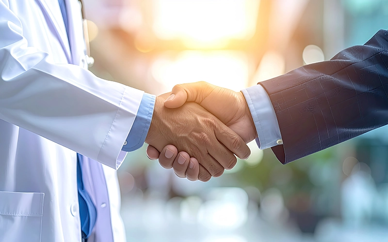 doctor and businessman handshake