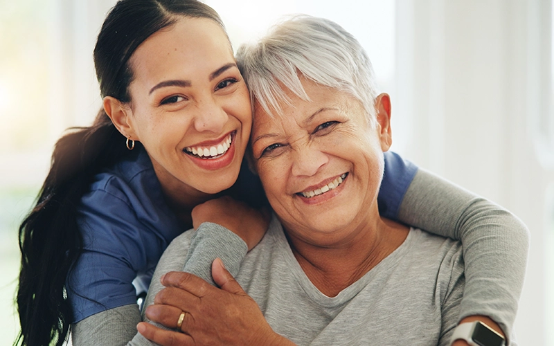 smiling woman doctor with woman patient
